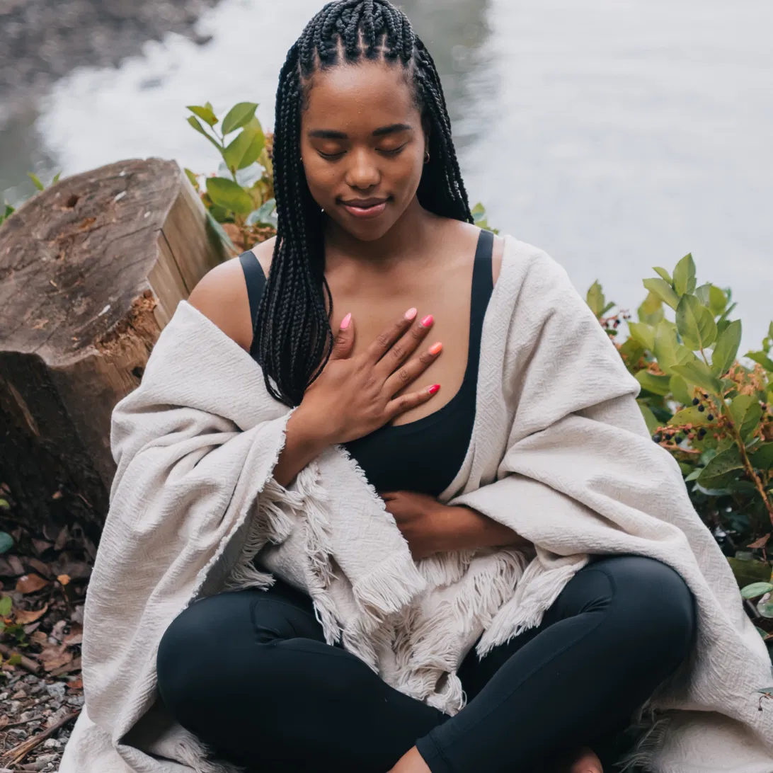 Black woman praying at sunset